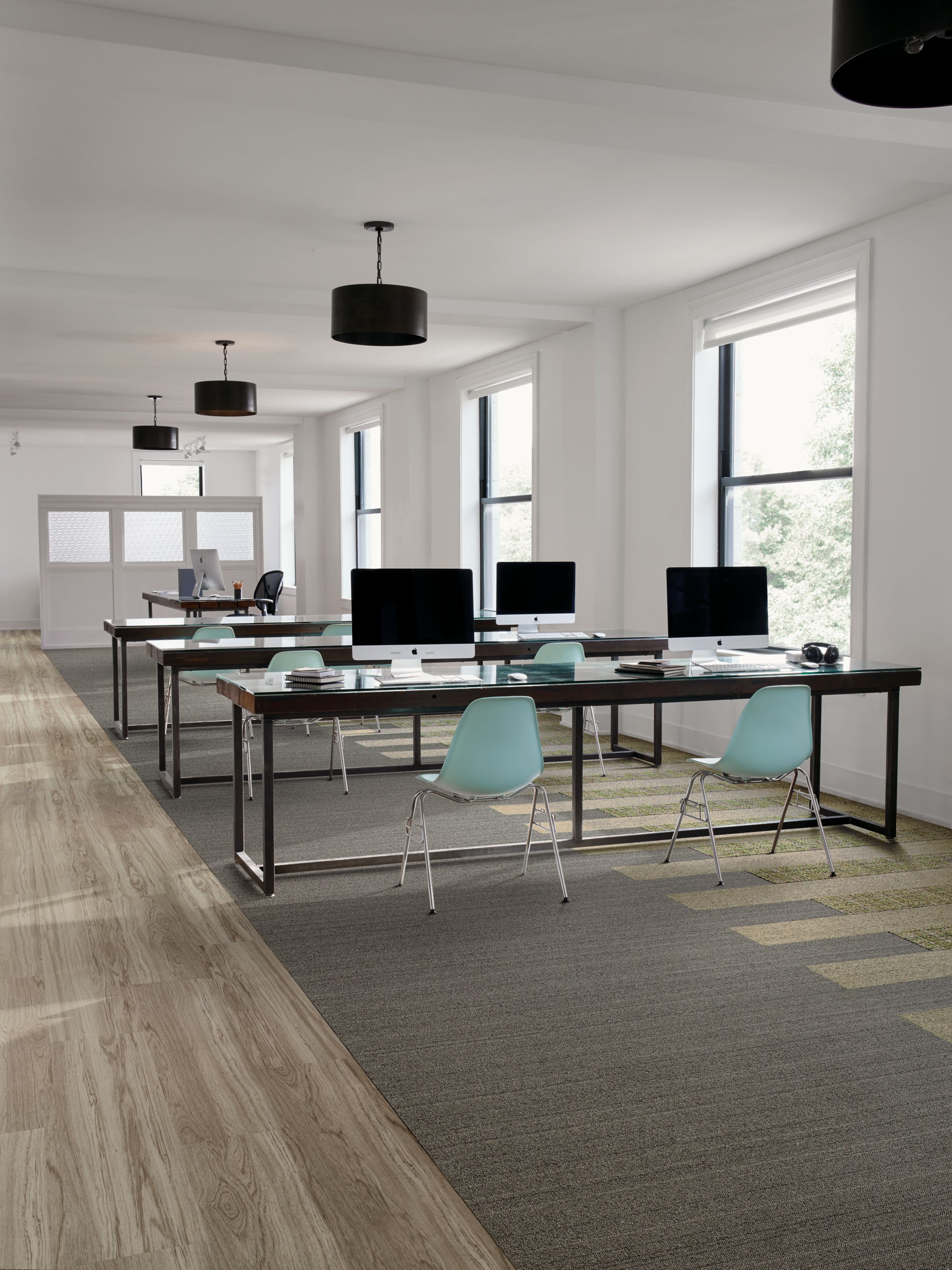 Interface WW860 and WW895 plank carpet tile in open work area with teal chairs image number 9